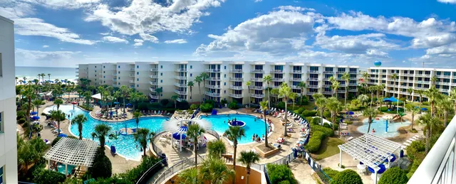 a bathroom with a shower curtain and a sink