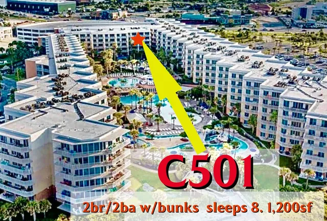 a living room with furniture and a lamp