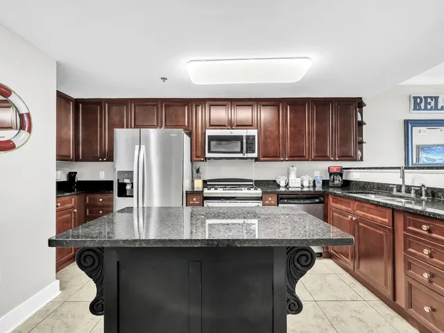 a view of city with tall buildings and a park