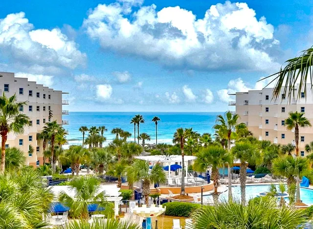 a view of a balcony with lake view and a potted plant
