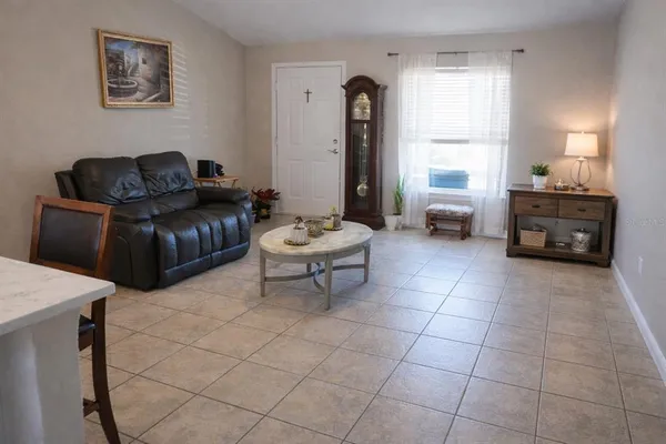 a living room with furniture and a window