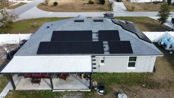 a top view of a house with a yard