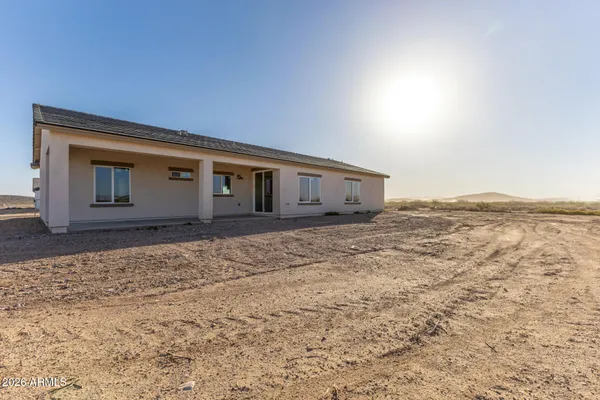 a house view with swimming pool