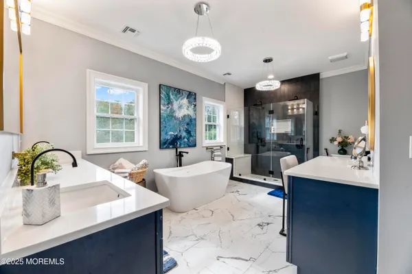 a large white kitchen with a large window