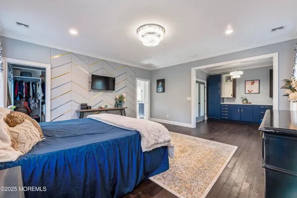 a bed room with a bed and a mirror