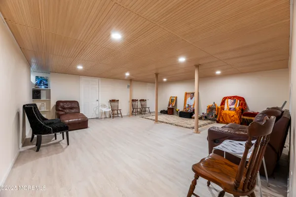 a living room with furniture and a gym equipment