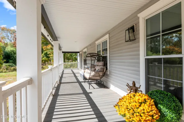 a view of balcony with wooden floor and outdoor space