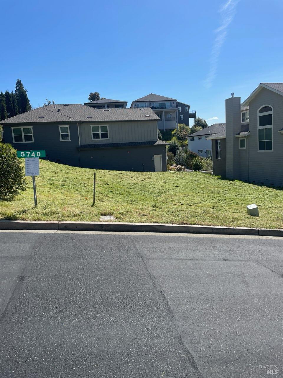 a view of a house with a yard and a large window