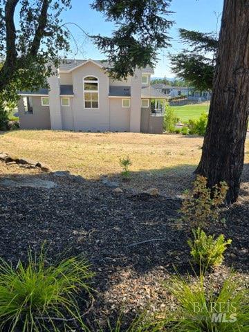 5740 Fairway Knoll Lane Santa Rosa, CA 95403 - Photo 4 of 5 a view of a house with a yard
