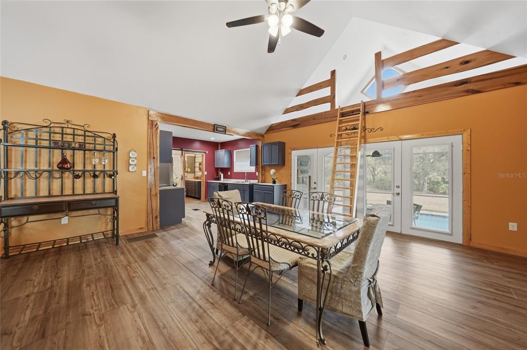 9796 Southwest Southern Dreams Road Arcadia, FL 34269 - Photo 11 of 72 a dining room with furniture window and wooden floor