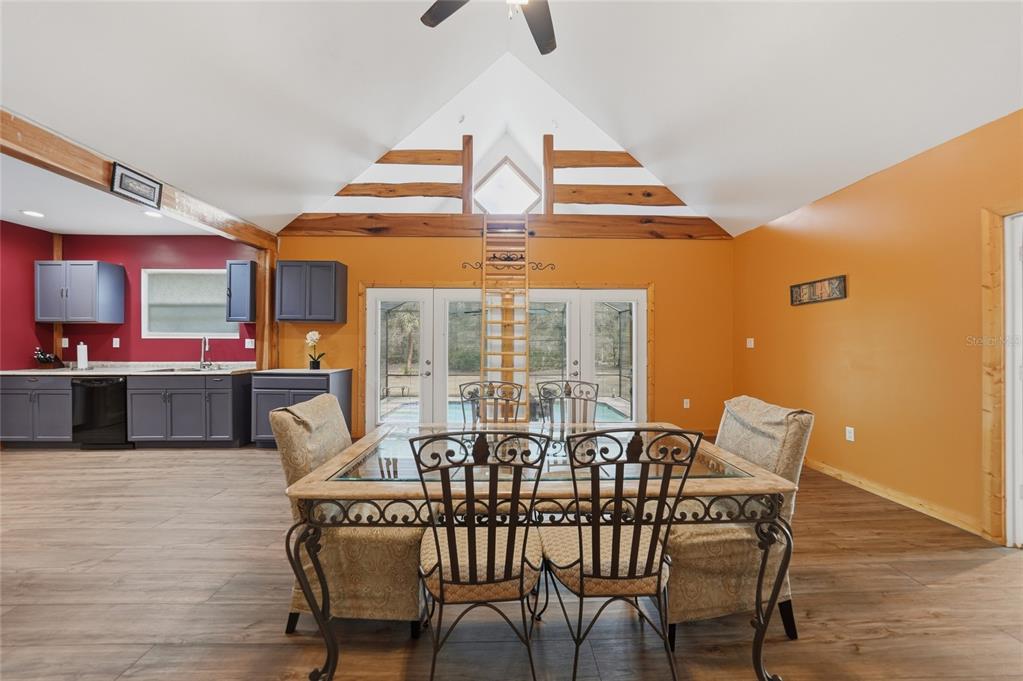 9796 Southwest Southern Dreams Road Arcadia, FL 34269 - Photo 12 of 72 a view of a dining room with furniture and wooden floor