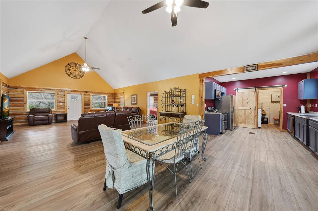 9796 Southwest Southern Dreams Road Arcadia, FL 34269 - Photo 14 of 72 a dining room with furniture and wooden floor
