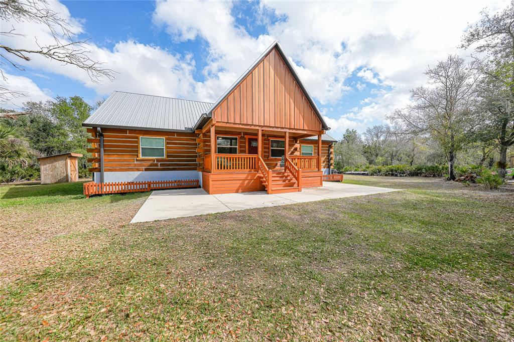 9796 Southwest Southern Dreams Road Arcadia, FL 34269 - Photo 2 of 72 a view of backyard with wooden fence
