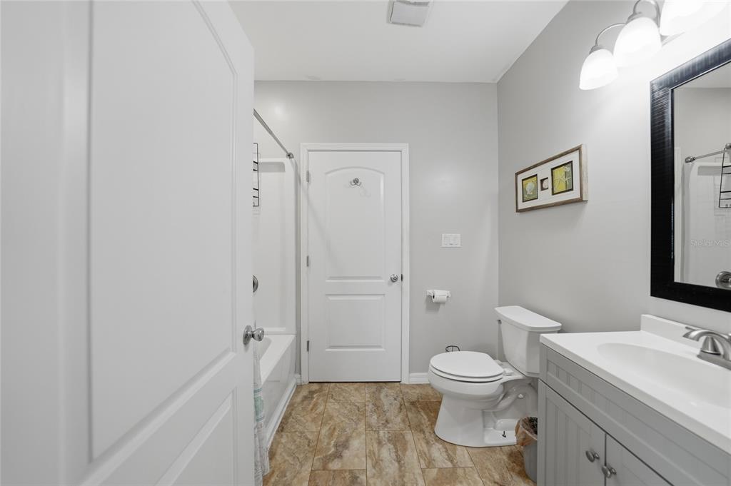 9796 Southwest Southern Dreams Road Arcadia, FL 34269 - Photo 32 of 72 a bathroom with a toilet sink a shower and a mirror