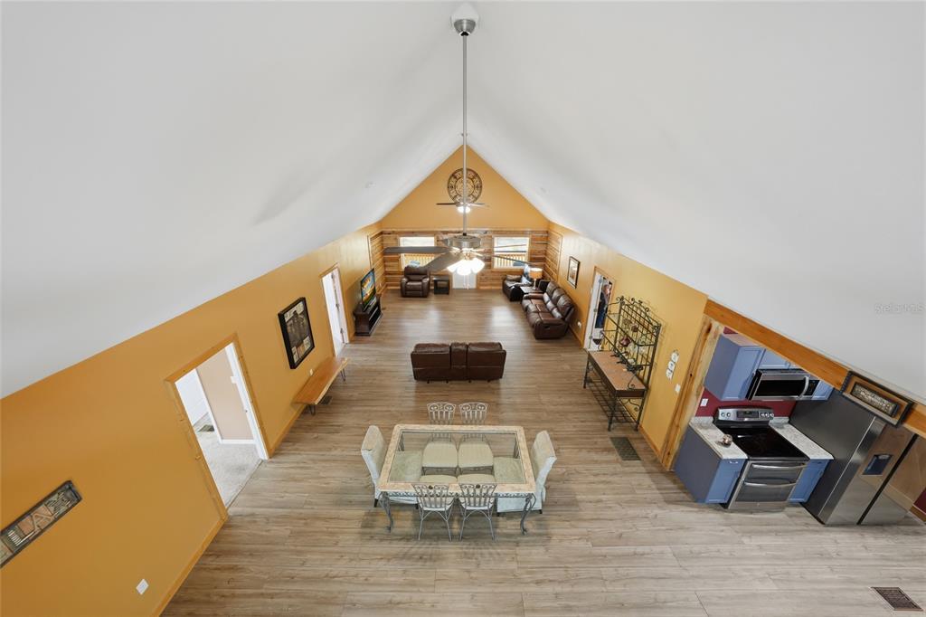 9796 Southwest Southern Dreams Road Arcadia, FL 34269 - Photo 33 of 72 a living room with furniture and a wooden floor