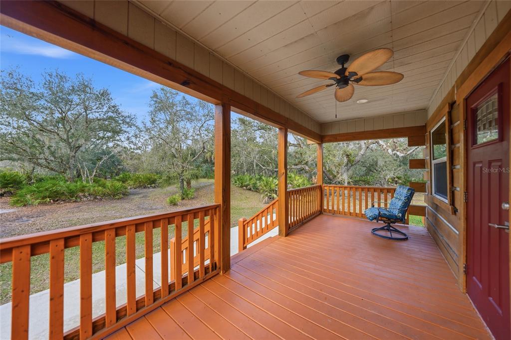 9796 Southwest Southern Dreams Road Arcadia, FL 34269 - Photo 39 of 72 a view of a porch with wooden floor and outdoor space