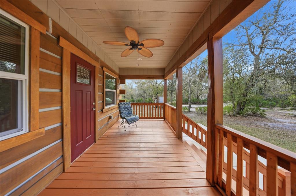 9796 Southwest Southern Dreams Road Arcadia, FL 34269 - Photo 40 of 72 a view of a balcony with wooden floor