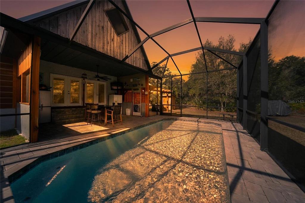 9796 Southwest Southern Dreams Road Arcadia, FL 34269 - Photo 50 of 72 a view of a swimming pool with a patio