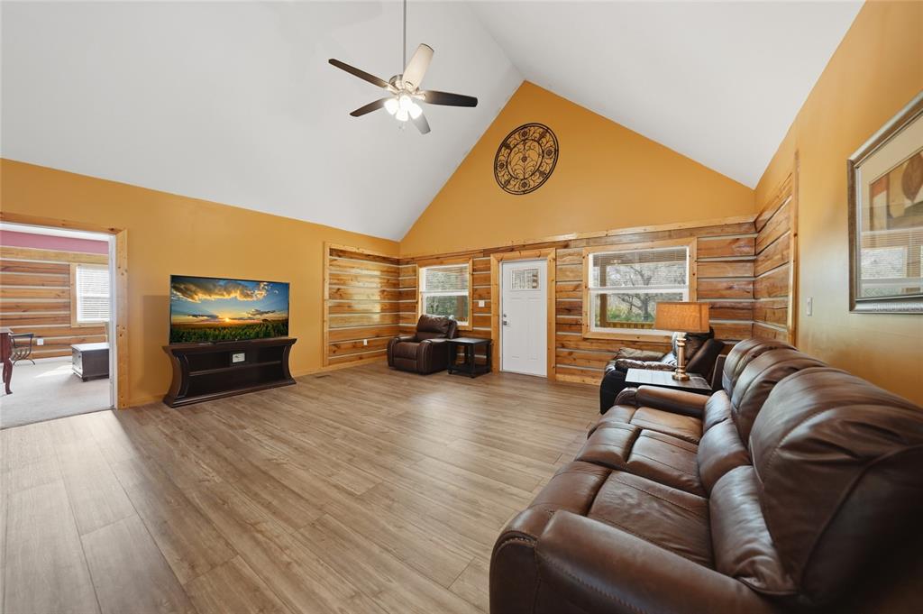 9796 Southwest Southern Dreams Road Arcadia, FL 34269 - Photo 5 of 72 a living room with furniture and a large window