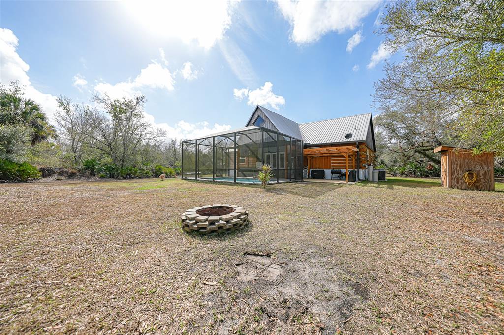 9796 Southwest Southern Dreams Road Arcadia, FL 34269 - Photo 54 of 72 a car parked in front of a house