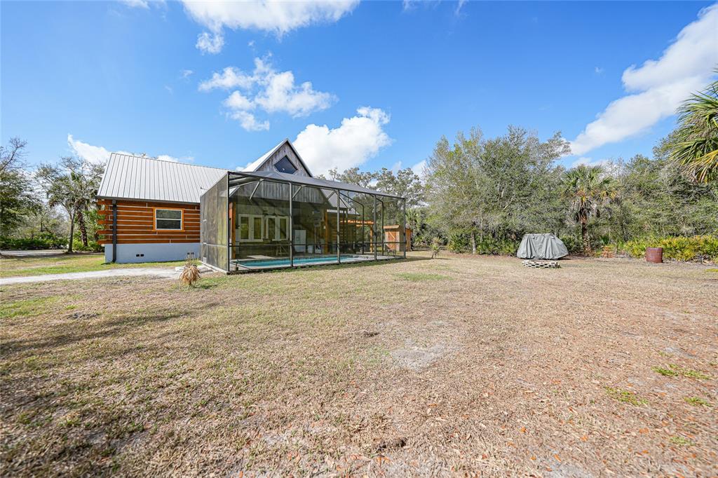 9796 Southwest Southern Dreams Road Arcadia, FL 34269 - Photo 56 of 72 a view of a house with a yard
