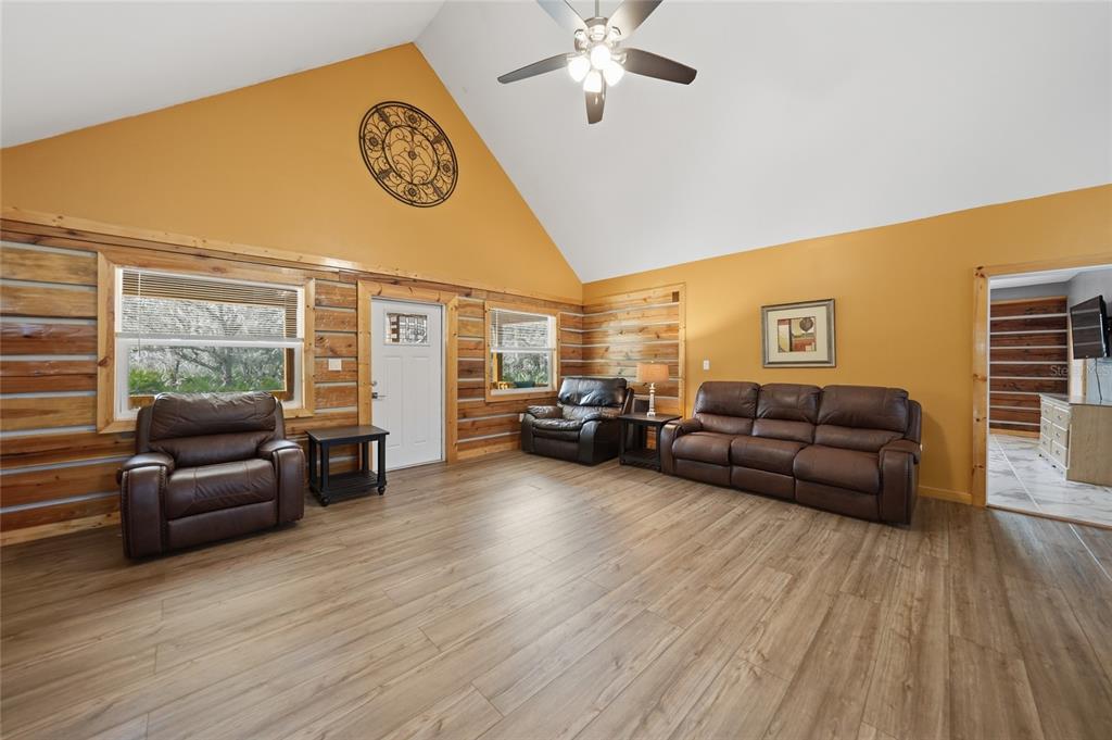 9796 Southwest Southern Dreams Road Arcadia, FL 34269 - Photo 6 of 72 a living room with furniture window and wooden floor