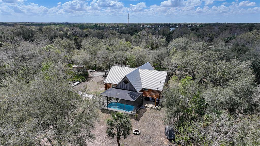 9796 Southwest Southern Dreams Road Arcadia, FL 34269 - Photo 66 of 72 an aerial view of a house with a yard and lake view