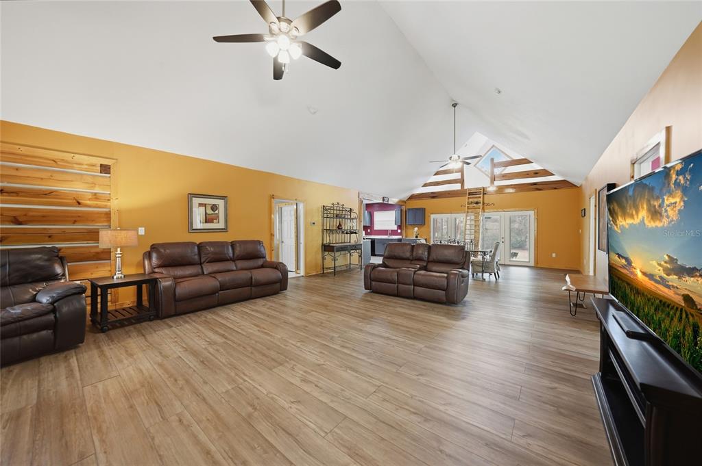 9796 Southwest Southern Dreams Road Arcadia, FL 34269 - Photo 10 of 72 a living room with furniture and a flat screen tv