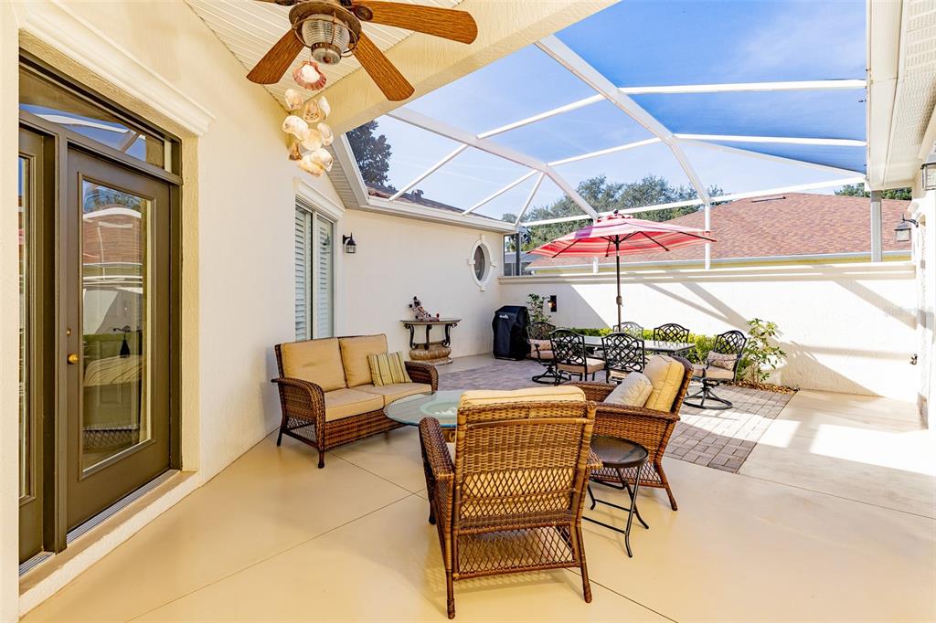 1250 Southwest 152nd Lane Ocala, FL 34473 - Photo 11 of 88 a patio with a table and chairs