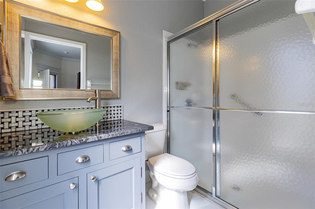 1250 Southwest 152nd Lane Ocala, FL 34473 - Photo 22 of 88 a bathroom with a granite countertop sink mirror vanity and toilet