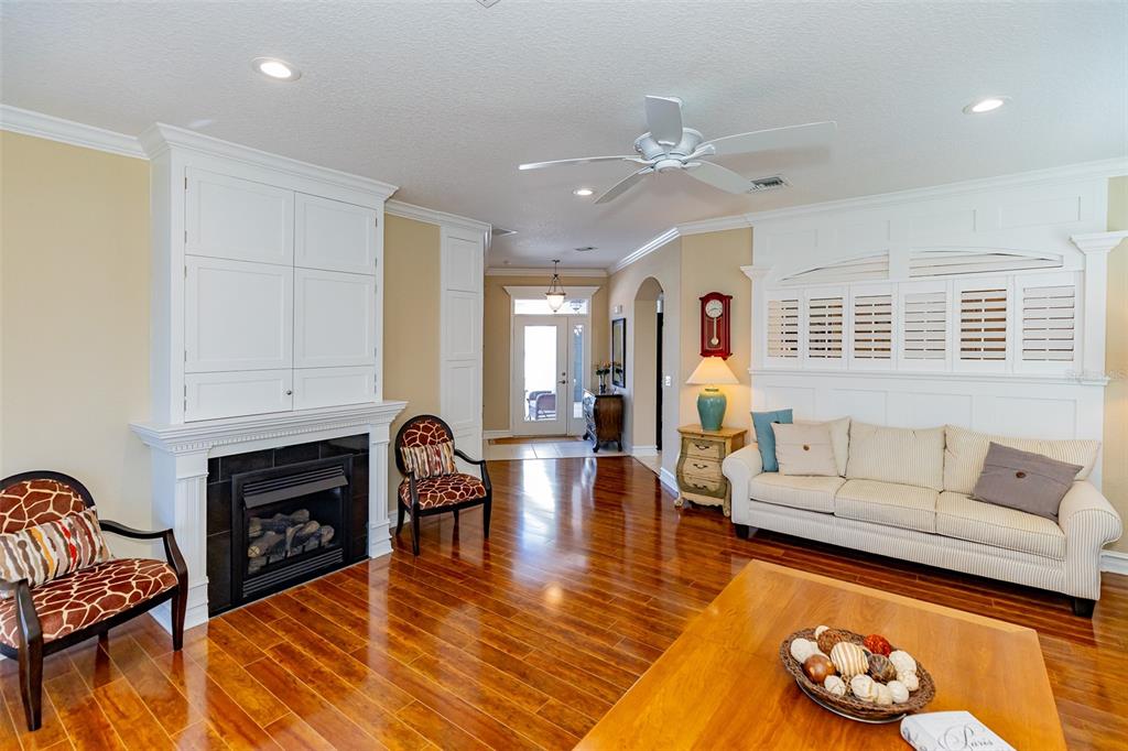 1250 Southwest 152nd Lane Ocala, FL 34473 - Photo 34 of 88 a living room with furniture fireplace and flat screen tv