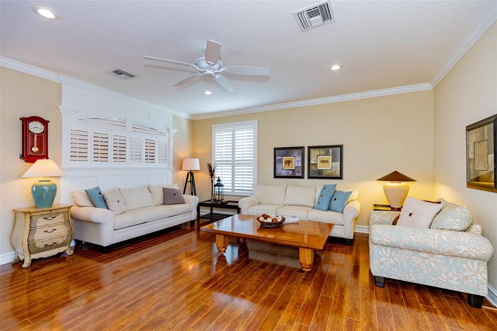 1250 Southwest 152nd Lane Ocala, FL 34473 - Photo 35 of 88 a living room with furniture and a wooden floor