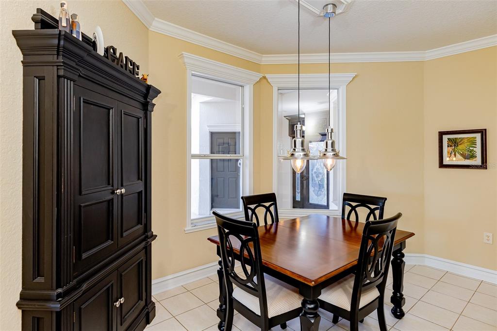 1250 Southwest 152nd Lane Ocala, FL 34473 - Photo 37 of 88 a view of a dining room with furniture and chandelier
