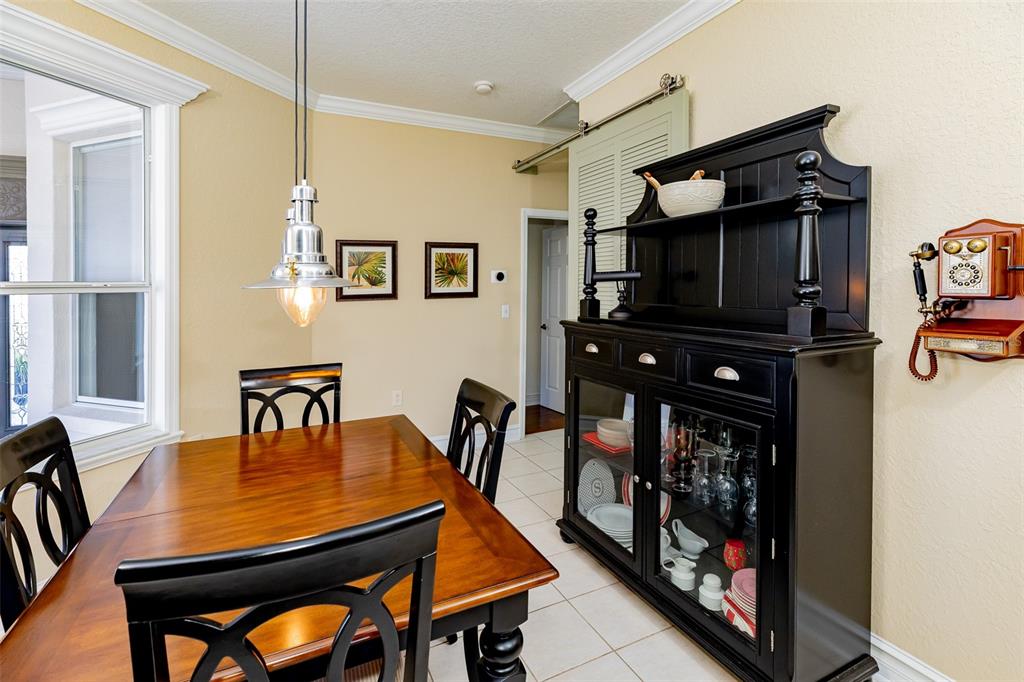 1250 Southwest 152nd Lane Ocala, FL 34473 - Photo 38 of 88 a living room with furniture and a flat screen tv