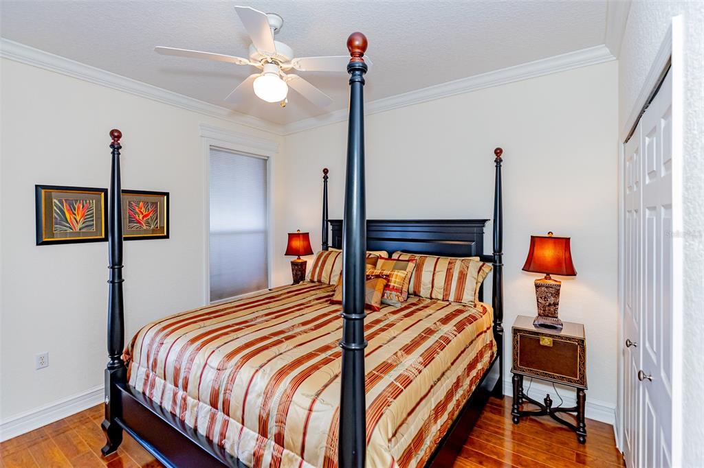 1250 Southwest 152nd Lane Ocala, FL 34473 - Photo 46 of 88 a bedroom with a bed and a chandelier