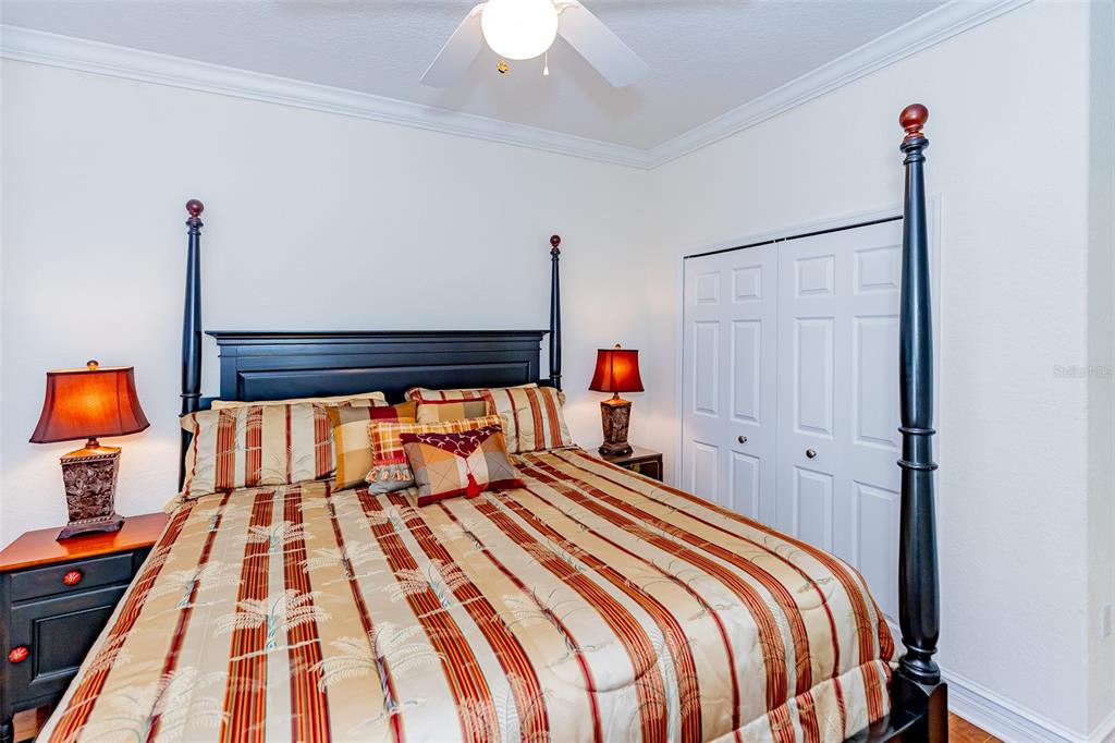 1250 Southwest 152nd Lane Ocala, FL 34473 - Photo 47 of 88 a bedroom with a bed and a lamp on dresser