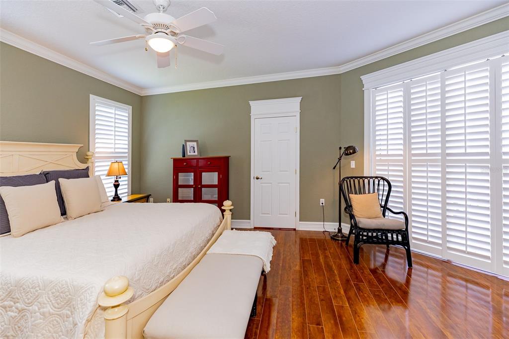 1250 Southwest 152nd Lane Ocala, FL 34473 - Photo 52 of 88 a bedroom with a bed and wooden floor