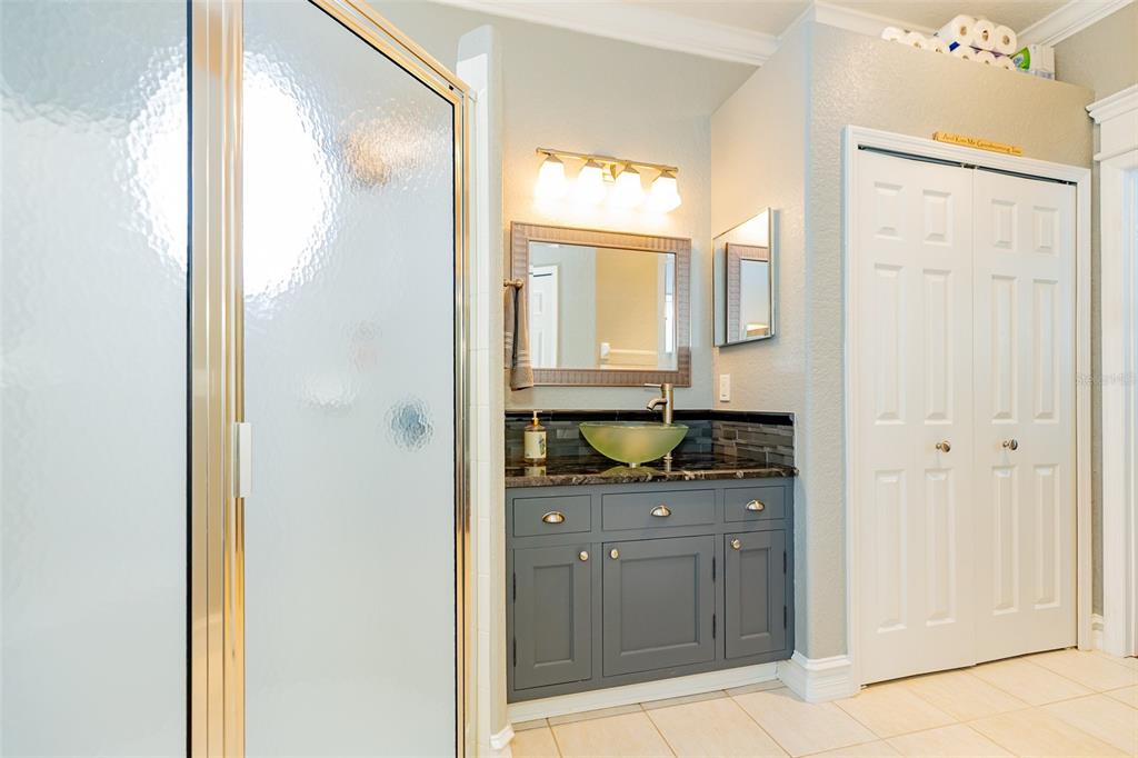1250 Southwest 152nd Lane Ocala, FL 34473 - Photo 56 of 88 a bathroom with a granite countertop sink and a mirror