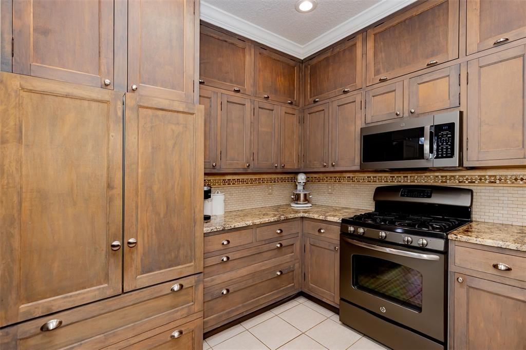 1250 Southwest 152nd Lane Ocala, FL 34473 - Photo 62 of 88 a kitchen with granite countertop cabinets appliances and a window