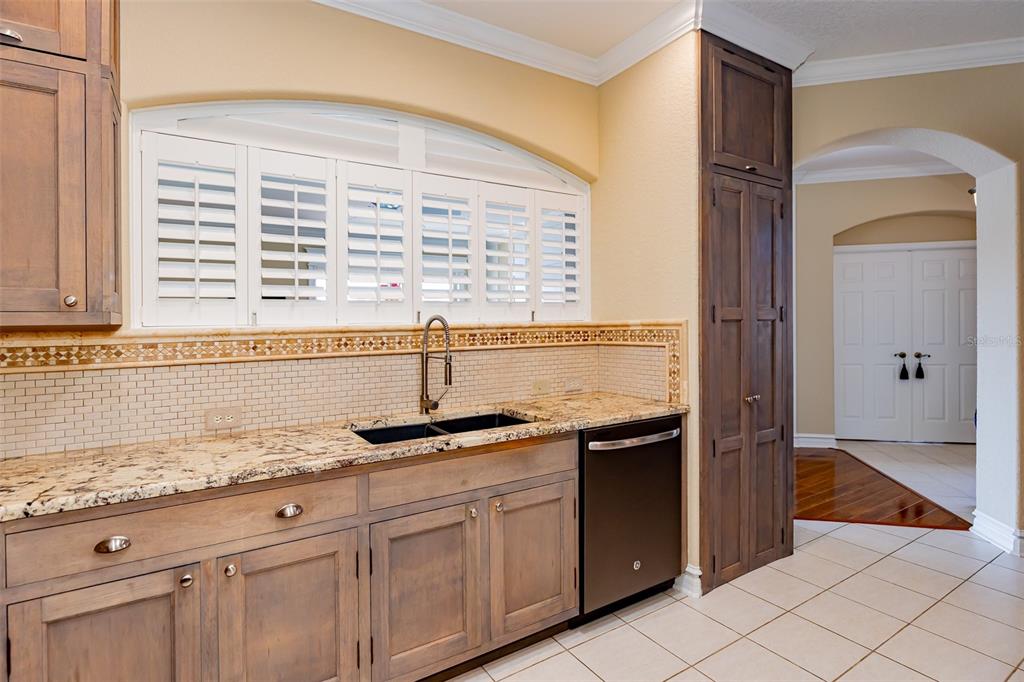 1250 Southwest 152nd Lane Ocala, FL 34473 - Photo 63 of 88 a kitchen with granite countertop a sink and a granite counter tops