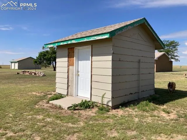 a big house with big yard and large trees