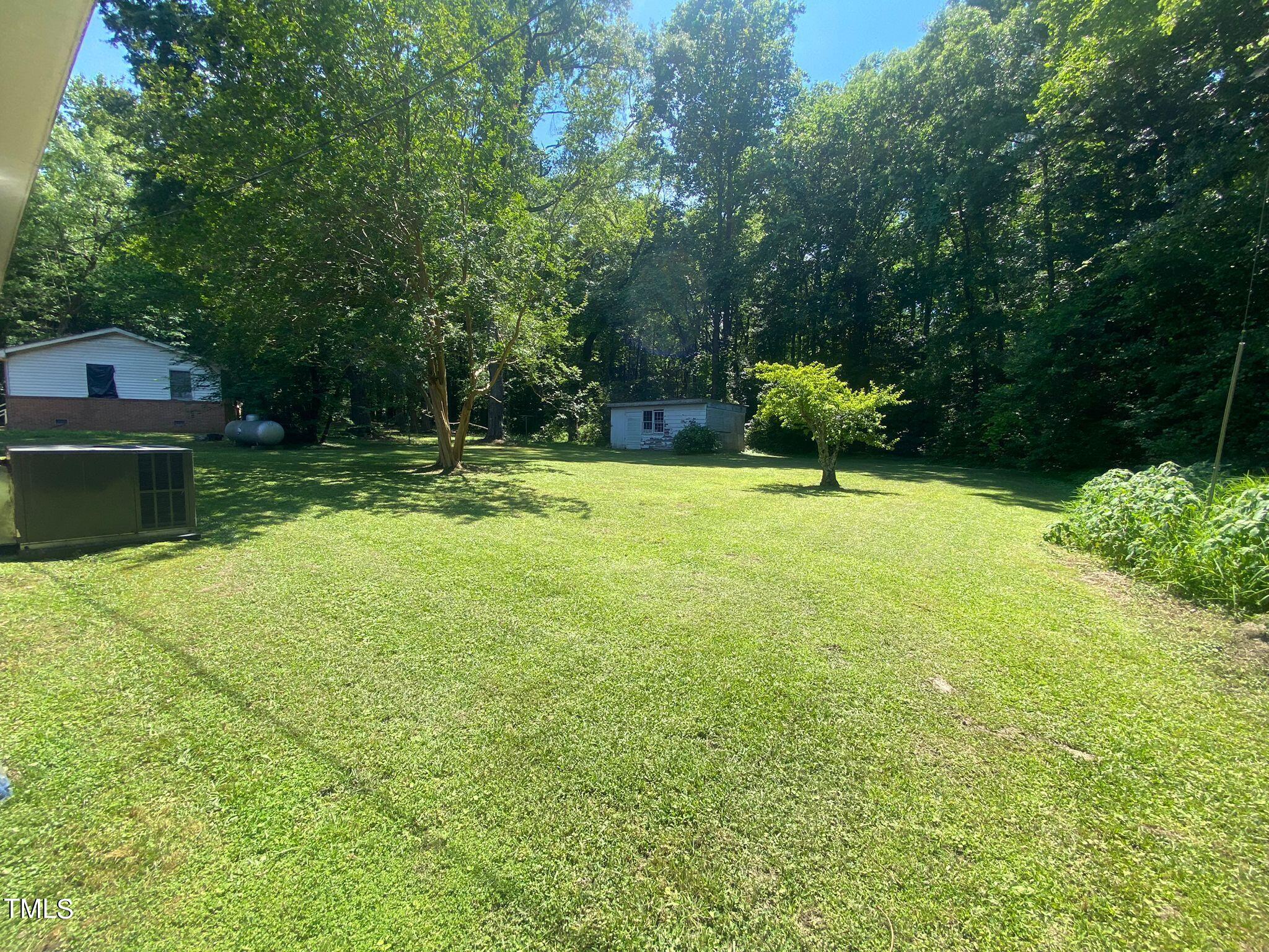 3933 Lizard Lick Road Wendell, NC 27591 - Photo 25 of 25 a view of a garden with a slide