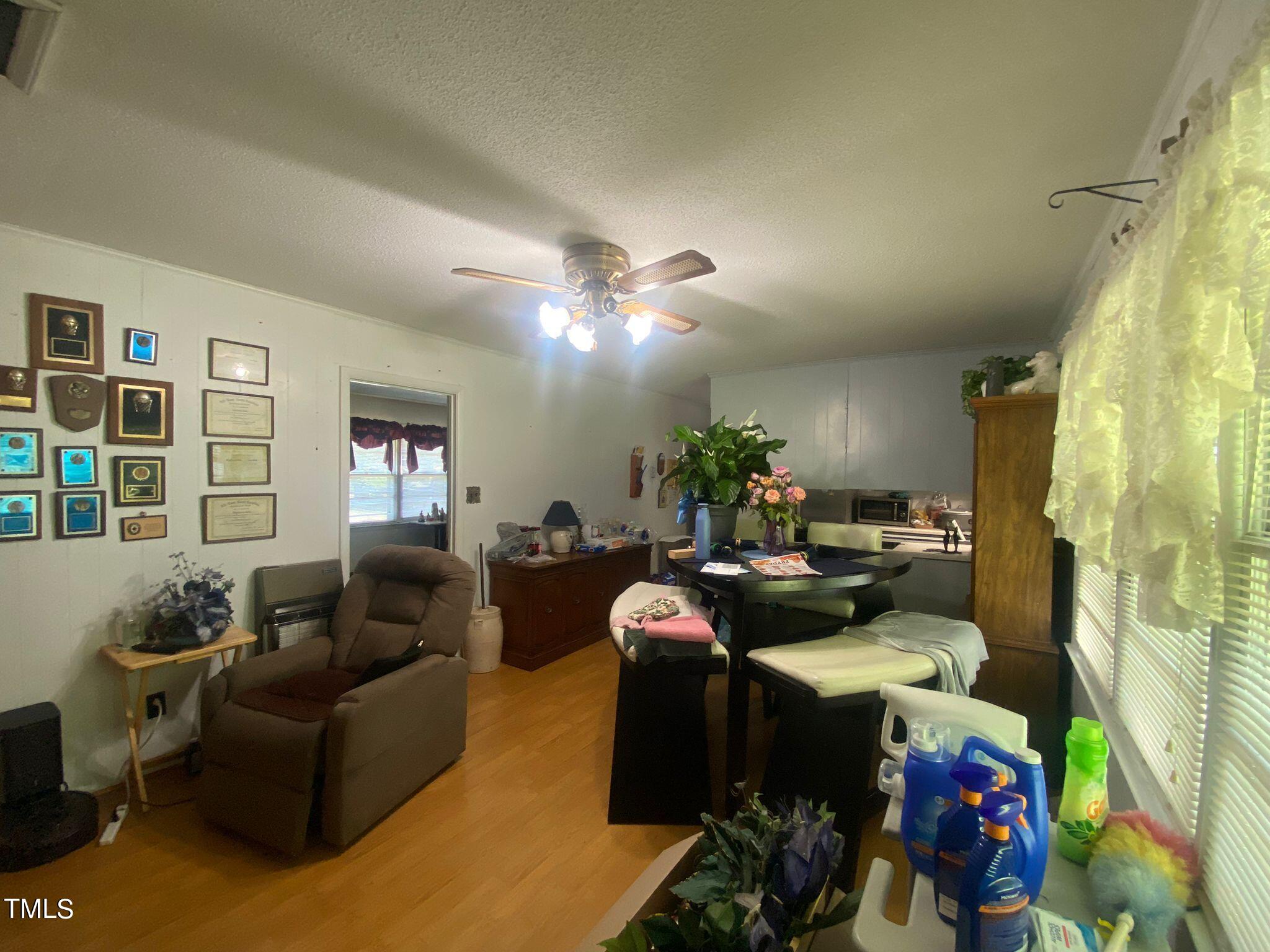 3933 Lizard Lick Road Wendell, NC 27591 - Photo 8 of 25 a living room with furniture and a window