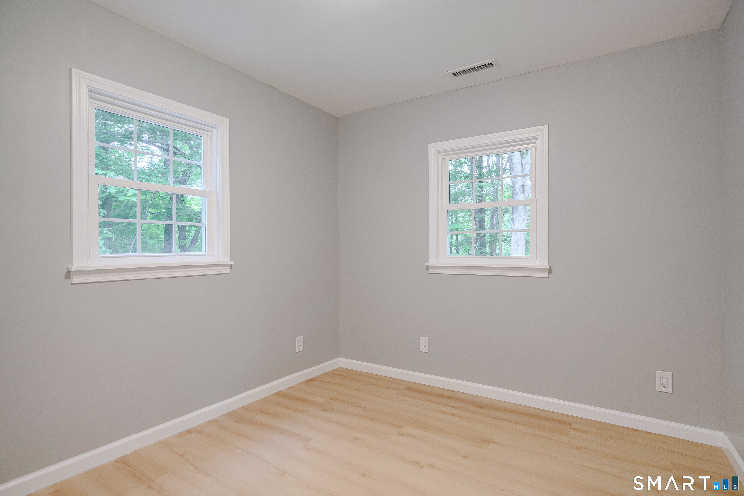 3 Botsford Hill Road Newtown, CT 06470 - Photo 17 of 25 Additional bedroom or office space with bright windows and wooded views.