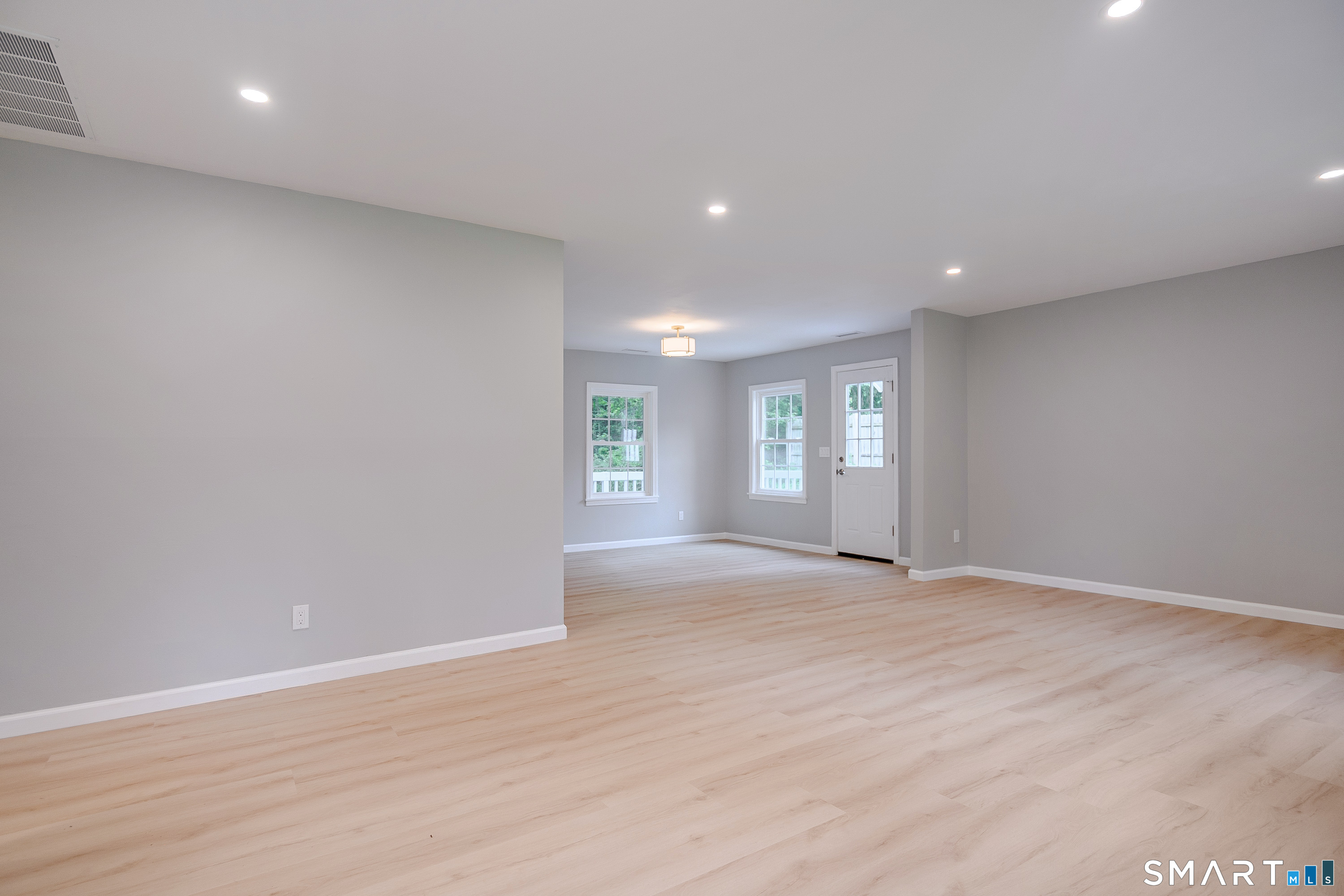3 Botsford Hill Road Newtown, CT 06470 - Photo 7 of 25 Seamless flow from living area to kitchen, ideal for everyday living and entertaining.