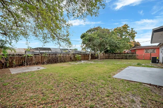 a backyard of a house with lots of green space