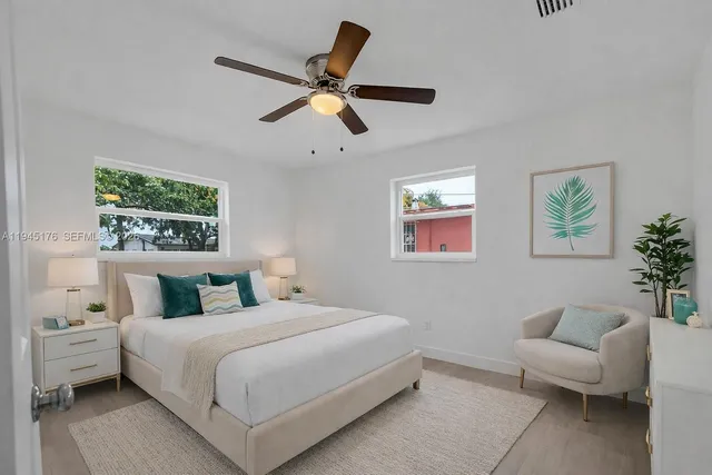 a bedroom with a bed and a couch