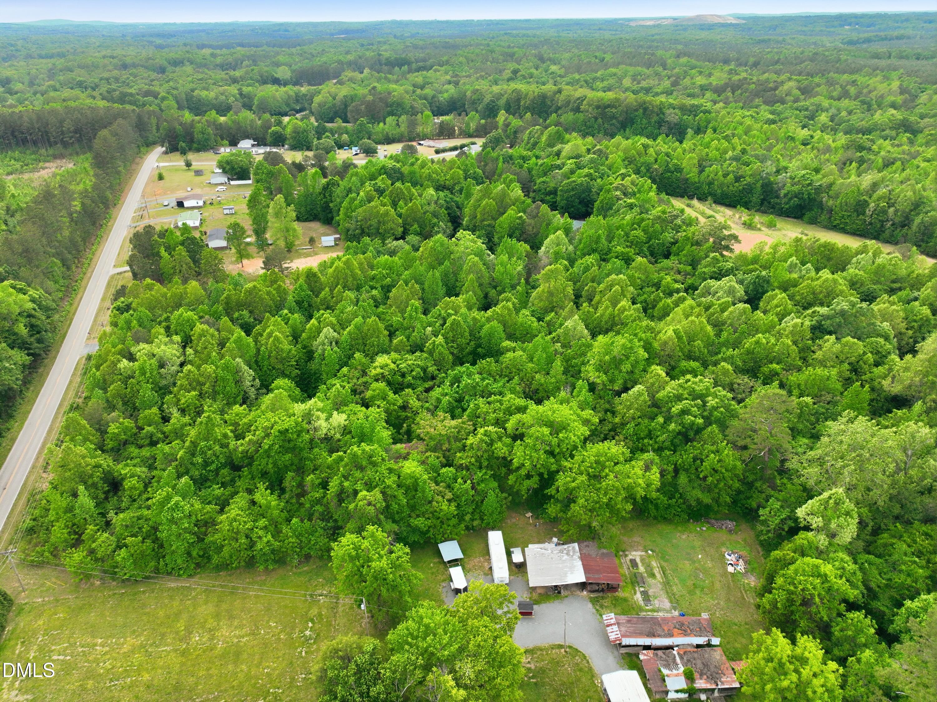 0 George Sherman Road Rougemont, NC 27572 - Photo 6 of 14 a view of a city with lush green forest