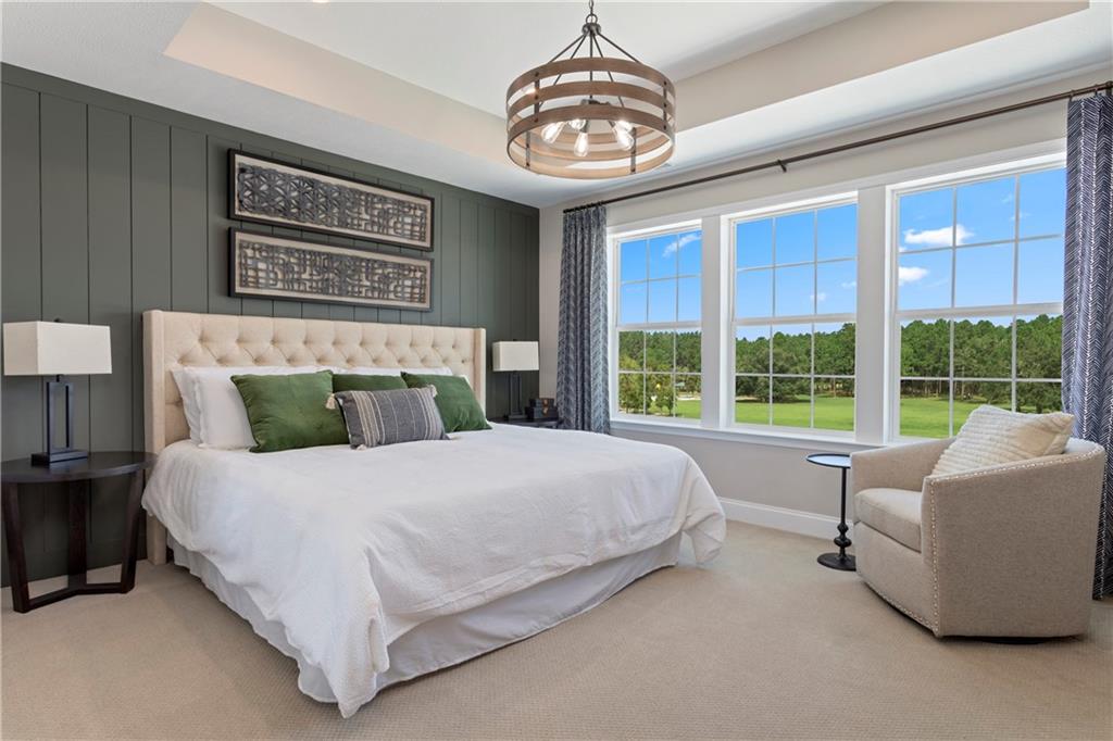 115 Affinity Drive Harmony, PA 16037 - Photo 6 of 16 a bedroom with a large bed and a chandelier