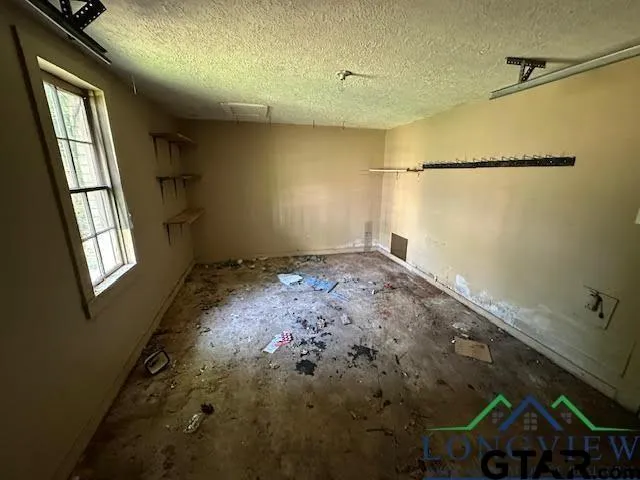 a view of empty room with windows